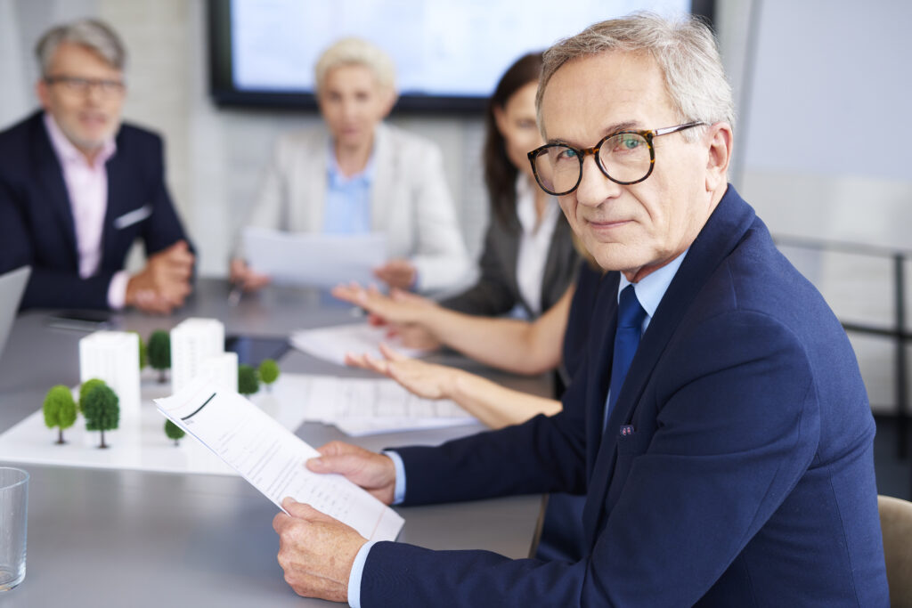 Portrait Of Senior Businessman During A Conference 2026 01 06 10 56 35 Utc 1024x683